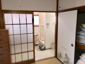 a room with a door leading to a bedroom at D-pdal Inn 1F - Vacation STAY 14134 in Tokyo