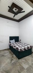 Ένα ή περισσότερα κρεβάτια σε δωμάτιο στο Bhumika home stay