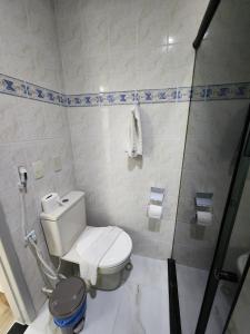 a bathroom with a toilet and a shower at BOA VIAGEM FLATS APTO 201 in Recife