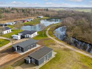 an aerial view of a house and a river at 4 star holiday home in Ringkøbing in Ringkøbing