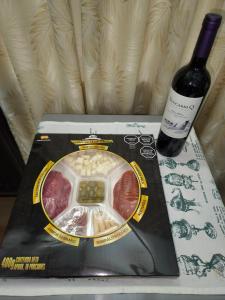 a bottle of wine sitting next to a box of meat at Chalet Gardel in San Francisco