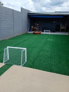 a artificial grass soccer field with a goal at Espaço de Lazer Poço Valioso in Mogi das Cruzes