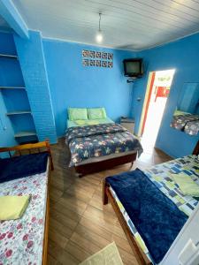 Una cama o camas en una habitación de Pousada La bodeguita