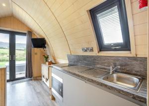a kitchen in a tiny house with a sink at South View Retreat in Carlton +25 photos