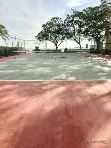 a tennis court with trees on top of it at Irama Kopa - Glory Beach Resort in Port Dickson +7 photos