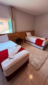 Ένα ή περισσότερα κρεβάτια σε δωμάτιο στο Navega Praia Casa