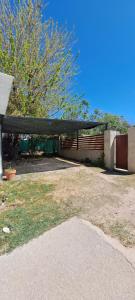 a house with a pavilion in a yard at Departamento familiar con pileta exclusiva in Villa Carlos Paz
