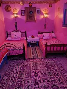 Postel nebo postele na pokoji v ubytování Miral Nubian House
