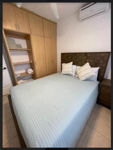 a bedroom with a large bed in a room at Residences Malaga Dream Paradise in Parrita