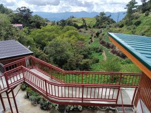 a balcony of a house with a view of a mountain at Mount Pulag SMR Homestay in Kabayan