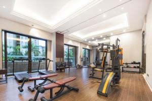a gym with treadmills and exercise equipment in a building at Boao Holliyard hotel in Qionghai