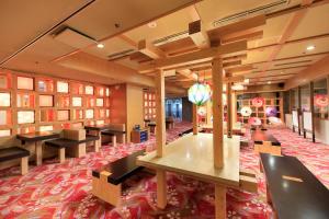 a library with black tables and a red carpet at Aishinkan in Morioka