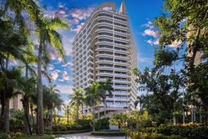 a rendering of a tall building with palm trees at Boao Holliyard hotel in Qionghai