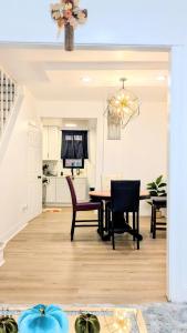 a kitchen and dining room with a table and chairs at Luxury 2bedrooms 1bath home near philly museum Temple and center city in Philadelphia