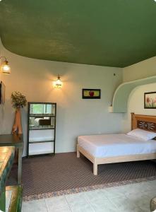 En eller flere senge i et værelse på Departamentos paraiso de adan1