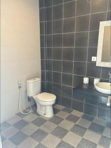 a bathroom with a toilet and a sink at Ultimate Canggu Access 1 in Canggu