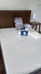 a bed with two pillows and a blue box on it at Pittsburgh Shadyside 3B Bright&Stylish Private Bd in Pittsburgh