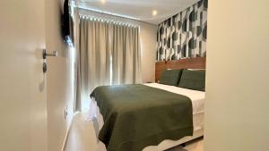 Postel nebo postele na pokoji v ubytování Book Santos Unlimited 1809 - Vista Mar & Piscina