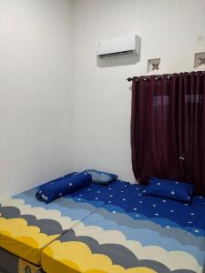 Ένα ή περισσότερα κρεβάτια σε δωμάτιο στο Nevia House - Comfortable Place With Family