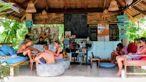 a group of people sitting in chairs in a room at Ilakai Hostel in General Luna +50 photos