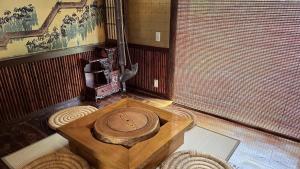 a room with a wooden table in a room at 天空のお宿 雅館 in Ichinoseki
