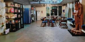 a room with tables and chairs in a store at Super Collection O Vastukar Retreat in Bhubaneshwar