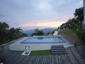 Bazén v ubytování Vandhanam Stays nebo v jeho okolí