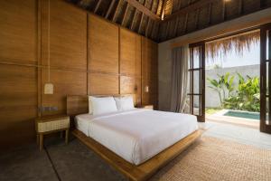 Ένα ή περισσότερα κρεβάτια σε δωμάτιο στο Angelian Boutique Hotel, Bingin - Uluwatu