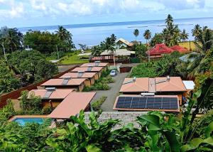 an aerial view of a resort with solar panels at Fare Atihau Vairao in Matiti