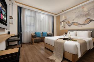 Postel nebo postele na pokoji v ubytování 博雅酒店张家界国家森林公园店 + 54 fotografií