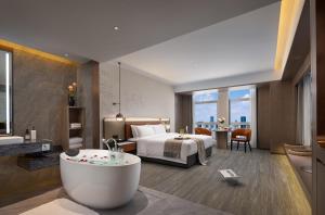 Χώρος καθιστικού στο 长沙温德姆花园酒店-世界之窗芒果馆店 +49 φωτογραφίες