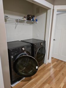 a washer and dryer in a laundry room at Eden Prairie Home in Eden Prairie