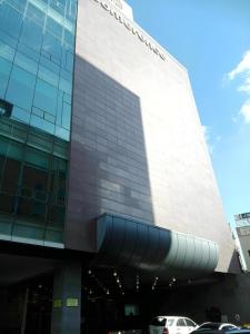 a building with cars parked in front of it at Hotel Sunshine in Daejeon