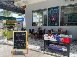 a restaurant with a foosball table in front of a store at CATBA PANDORA Hotel & Travel in Cat Ba