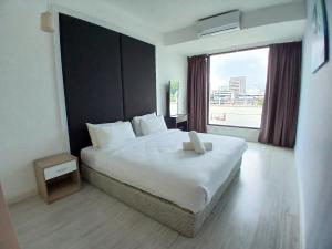 Postel nebo postele na pokoji v ubytování Agrowth at Sky Suites