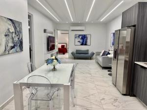 a living room with a white table and chairs at FYV Beach Villas in San Juan +62 photos