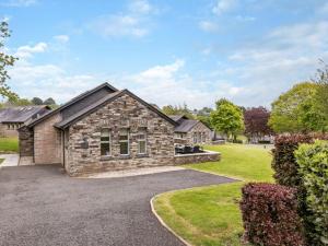 a stone house with a driveway at 3 Bed in St. Mellion 87717 in St Mellion