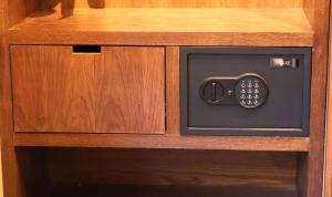 a microwave oven sitting inside of a wooden cabinet at A beautiful apartment in the center in Valle de Bravo