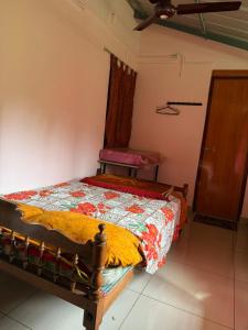 Ένα ή περισσότερα κρεβάτια σε δωμάτιο στο Nanavu Farmhouse +7 φωτογραφίες