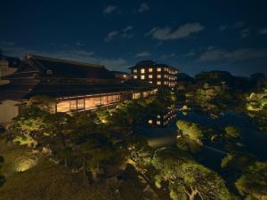 an overhead view of a building and a river at night at Ohana in Yanagawa