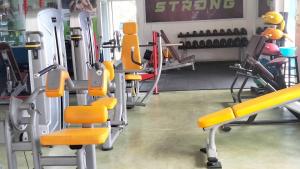 a gym with a bunch of tread machines in it at DS Sport Hostel in Ko Lanta +5 photos