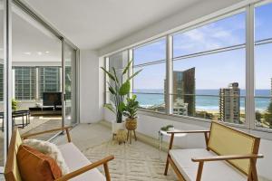 a living room with a view of the ocean at Q Resort on Hamilton Avenue - Hosted by Gold Coast Luxury Resorts in Gold Coast