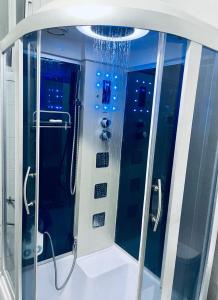 a shower in a bathroom with at Beautiful apartment in front of Playce Palmeraie Faya in Abidjan