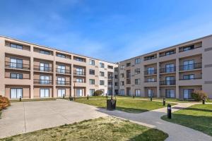 an apartment building with a pathway in front at Comfort Inn & Suites Arlington Heights - Buffalo Grove in Arlington Heights