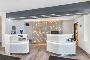 a dental office with white desks and a wall with a crescent at Comfort Inn & Suites Arlington Heights - Buffalo Grove in Arlington Heights