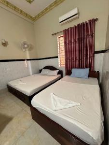 Postel nebo postele na pokoji v ubytování Mohaleap Shanghai Guest House