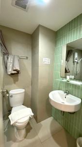 a bathroom with a toilet and a sink at POP Heritage Residence in Bangkok +37 photos