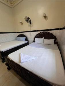 Postel nebo postele na pokoji v ubytování Mohaleap Shanghai Guest House + 4 fotografie