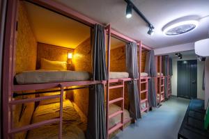 a group of bunk beds in a room at The Brownstone Hostel & Space in Ipoh