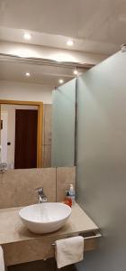 a bathroom with a sink and a mirror at 2 Room Flat near Uni Campus Siegen - BR in Siegen